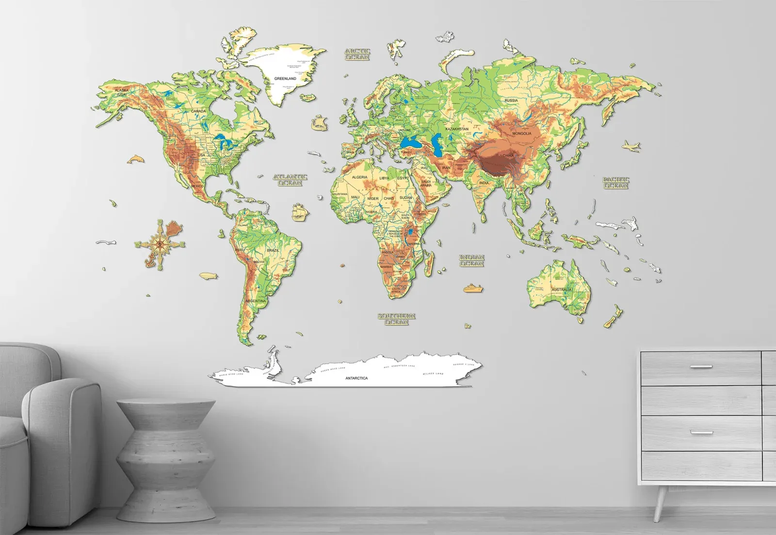Manufacturer image used for editorial comparison; source and rights metadata retained in the image library. A full-colour wooden world map showing printed terrain, rivers, borders and Antarctica