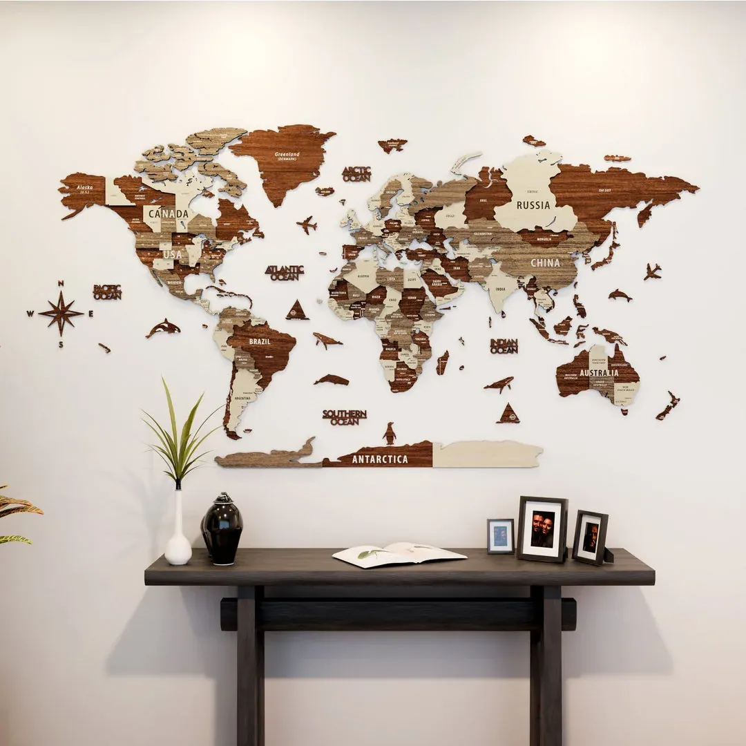 Warm multitone Colorfull Worlds wooden map with compass, Antarctica and decorative pieces above a console table