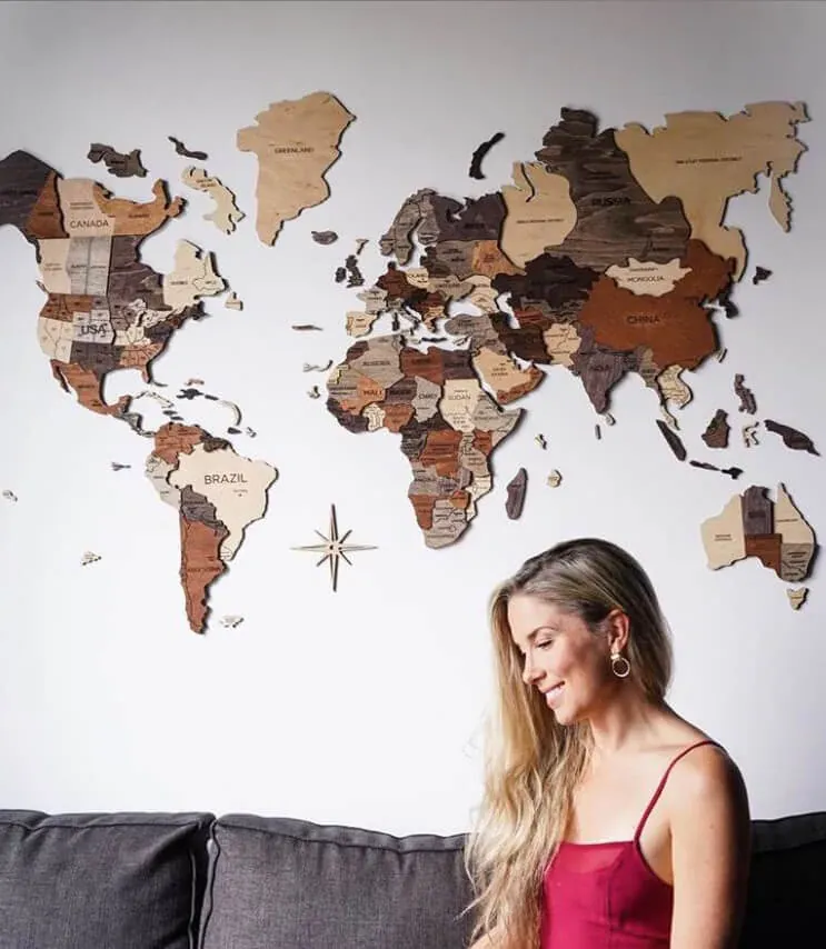 Multitone Wooden World Map product installed on a white wall above a sofa
